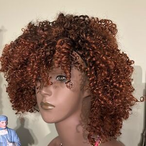 Synthetic wig curly/kinky cut.  Very full/thick.  NWT